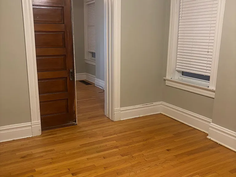 Den/Second Bedroom with pocket door half closed, looking toward Living Room