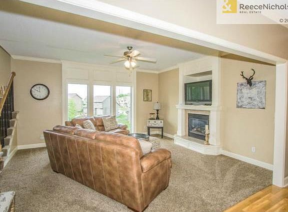 Great Room with New Carpet and Built In Entertainment Shelf Abov