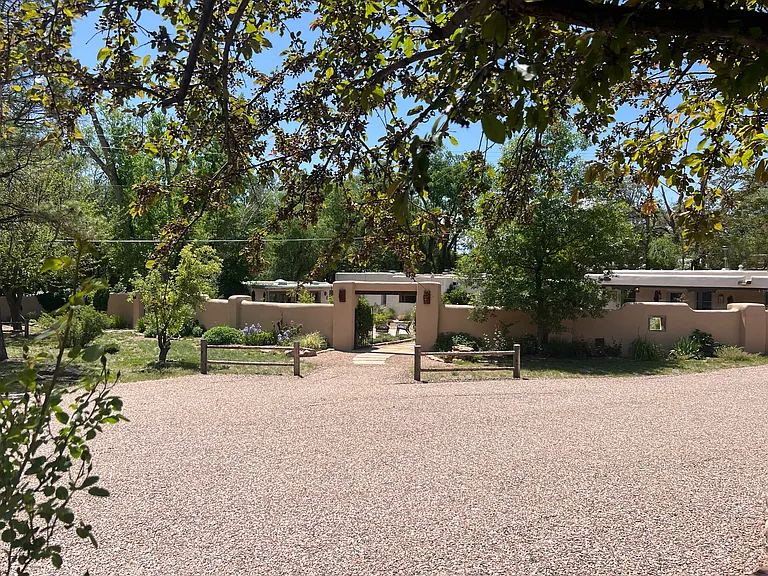 gated property with beautiful garden walls