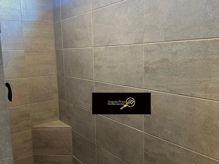 2 primary suites with fully tiled walk in showers & closets