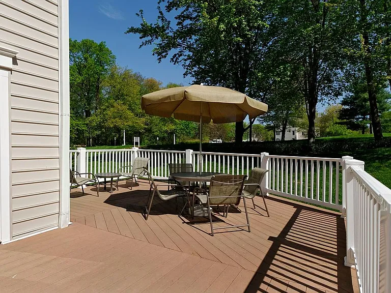 Resident lounge patio with dining area with seating