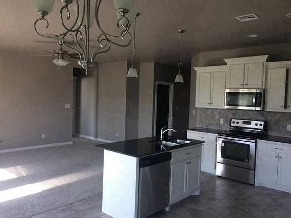 Kitchen w/stainless steel appliances. 