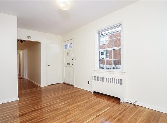 To your left is a spacious sunlit dining area.