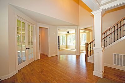 Spacious entry. Doors on the left lead to the den/office