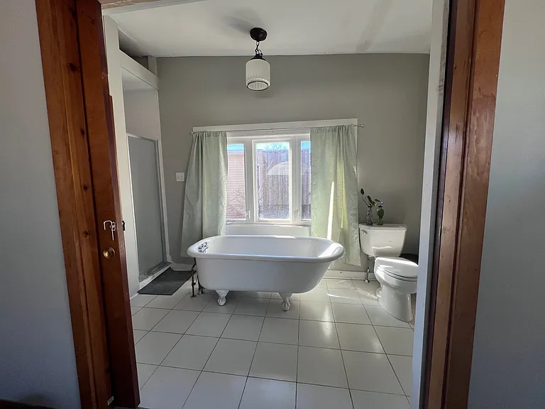 Vintage-inspired Bath w/ claw foot tub and stand alone shower.