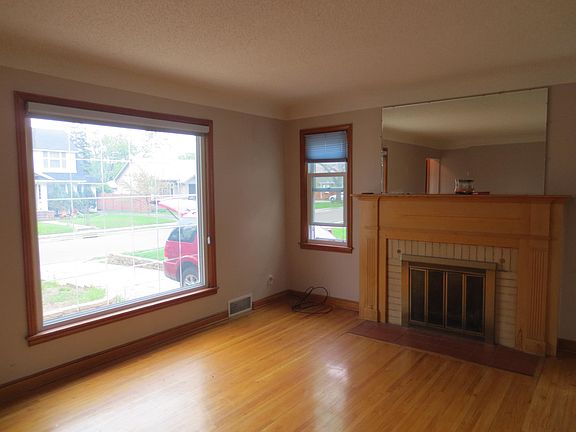 Living room with large front window and natural light