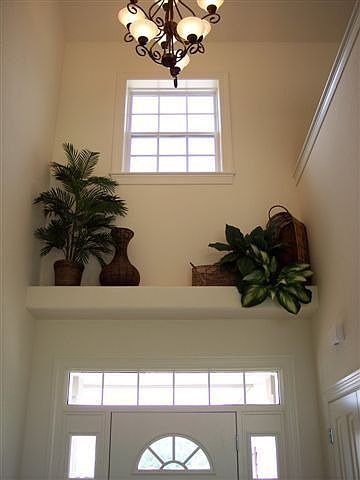 Foyer with dramatic volume ceilings