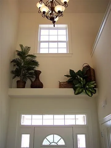Foyer with dramatic volume ceilings