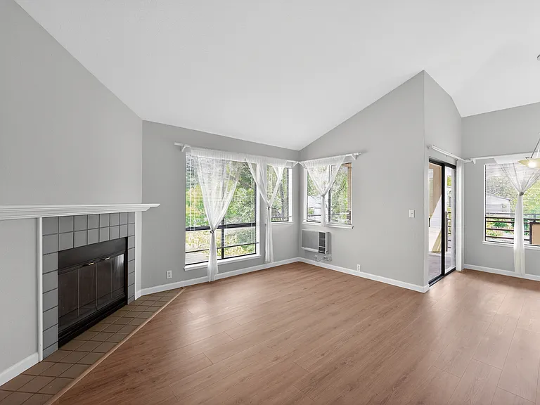 Vaulted ceilings and sunny living room. New flooring!