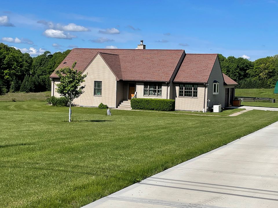 Front of the home, highlighting the new concrete driveway.