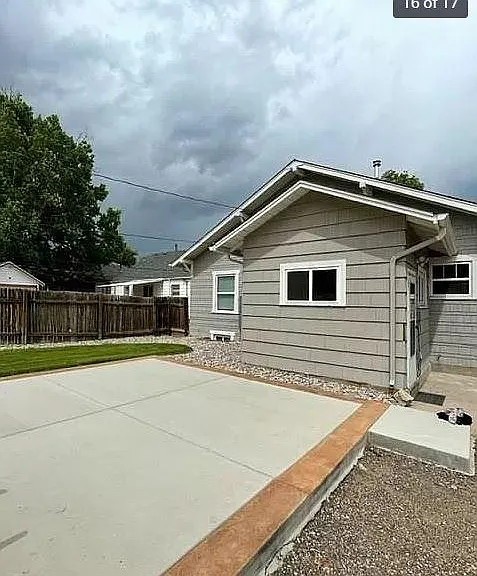 View of rear of house and cement deck