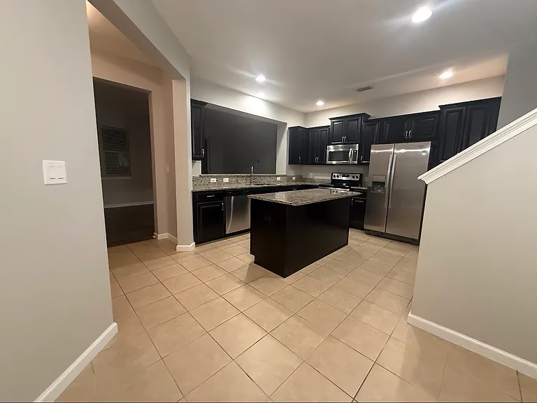 Kitchen with large granite island.