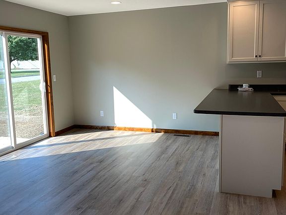 Dining looking out sliding glass door to small deck/patio