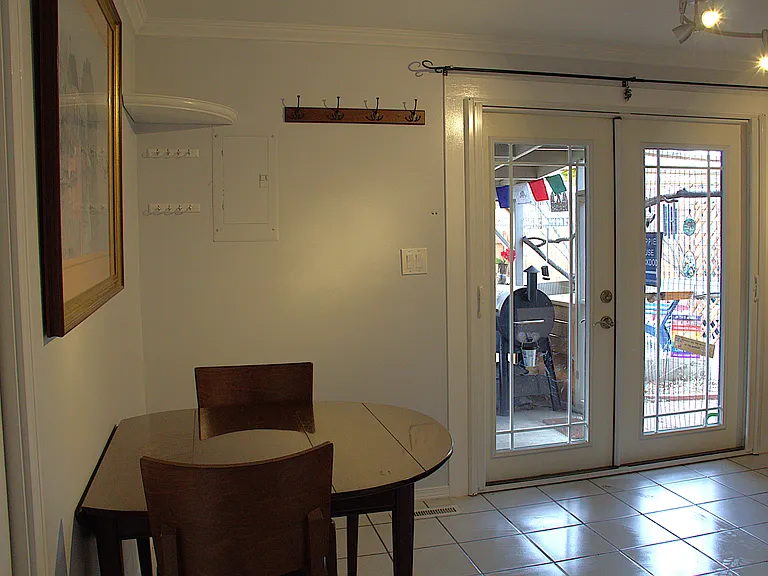 French doors to screen porch in kitchen/dining area