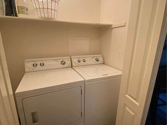Laundry in unit located in the hallway