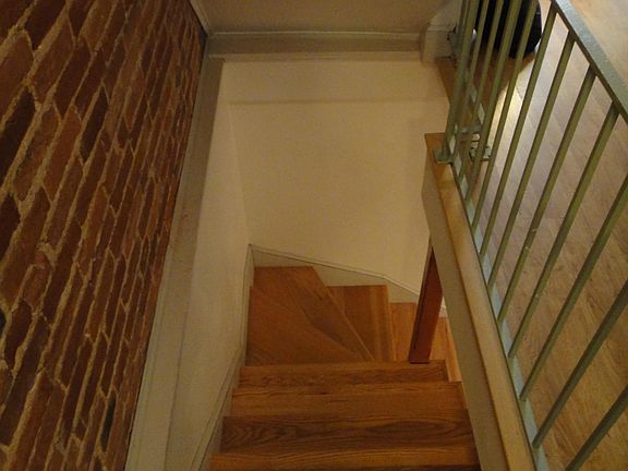 stairs to the downstairs half of the apartment