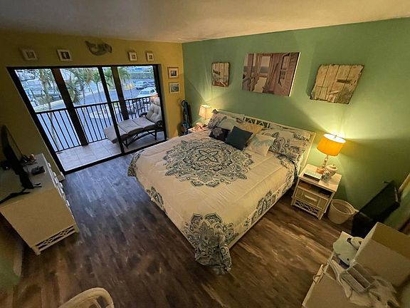 Fully Remodeled Master bedroom with it's OWN Lanai. You can watch the dolphins play in the canal while in bed. This 2nd Lanai, with all of the sunlight ,TRANSFORMS the master bedroom! The Master bedroom also has a new Stearns & Foster, King sized bed.