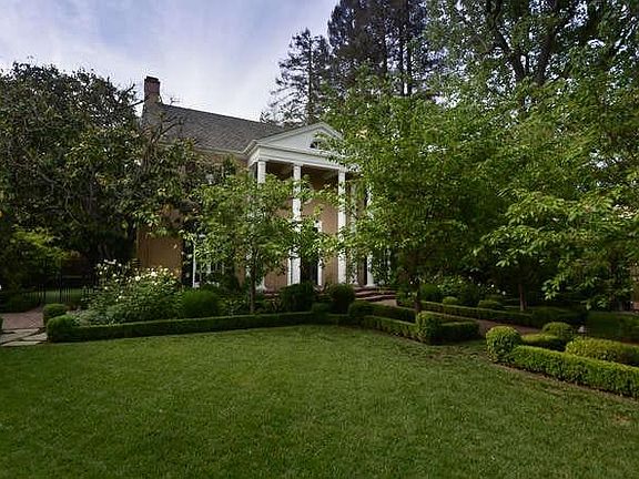 Spectacular quiet front yard with well maintained mature trees and lawn
