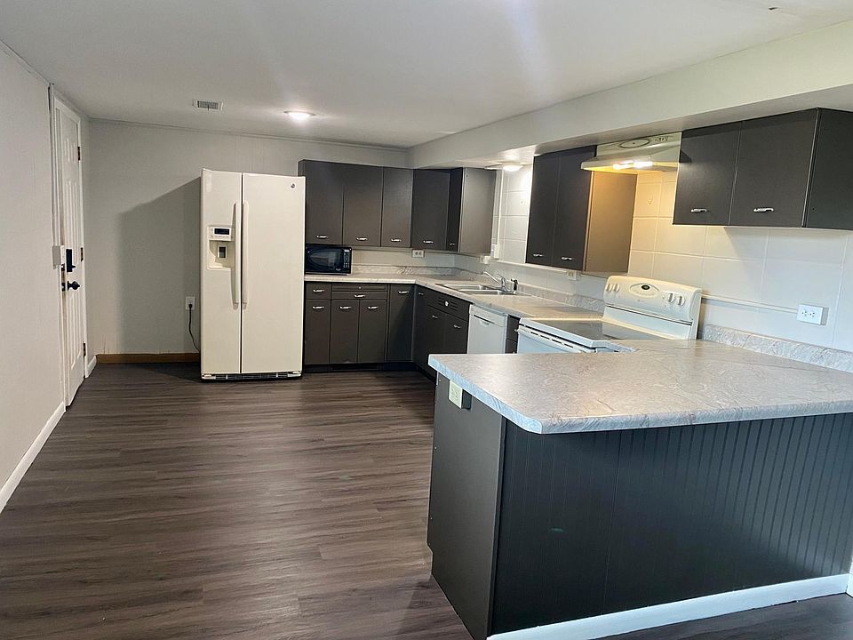 Kitchen- New flooring, counter tops & lighting. Updated appliances