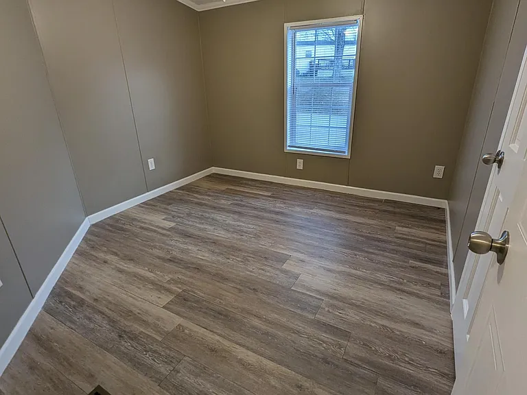 Bedroom 1 with ceiling fan, window and closet