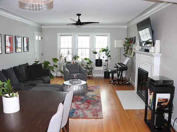 Main floor living room. Front door is in the upper left corner. Photo is taken from Kitchen doorway.