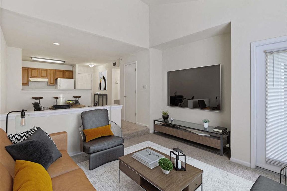 Modern open-concept living area with smart TV