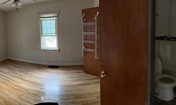 Main floor bedroom (off living room) with attached 1/2 bathroom