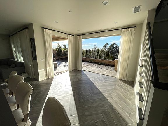 Kitchen view looking to the backyard. There are two multi-fold bay doors.