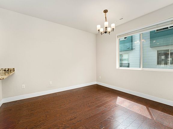 Dining room goals! _ This spacious room is an entertainer's delight, featuring beautiful hardwood floors and two large windows that flood the space with light. Just imagine the dinner parties you could host here!