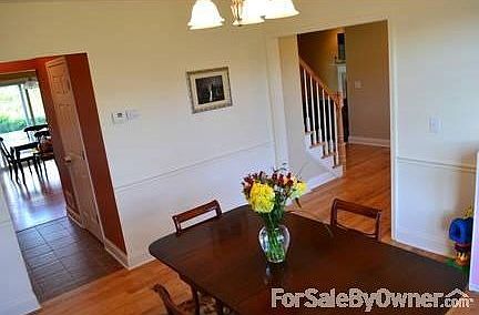 Dining Room
						:
						Hardwood Floors, Tray Ceiling, crown molding & chair rail
