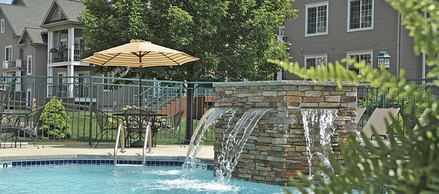 resort-style saltwater pool with waterfall