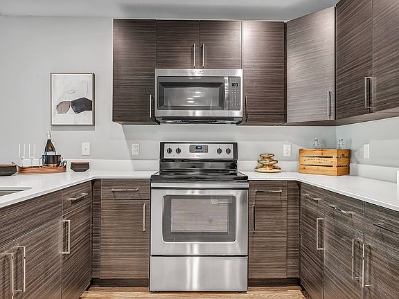 Cook and connectin our large kitchens featuring sleek stainless steel appliances and plenty of cabinets for storage.