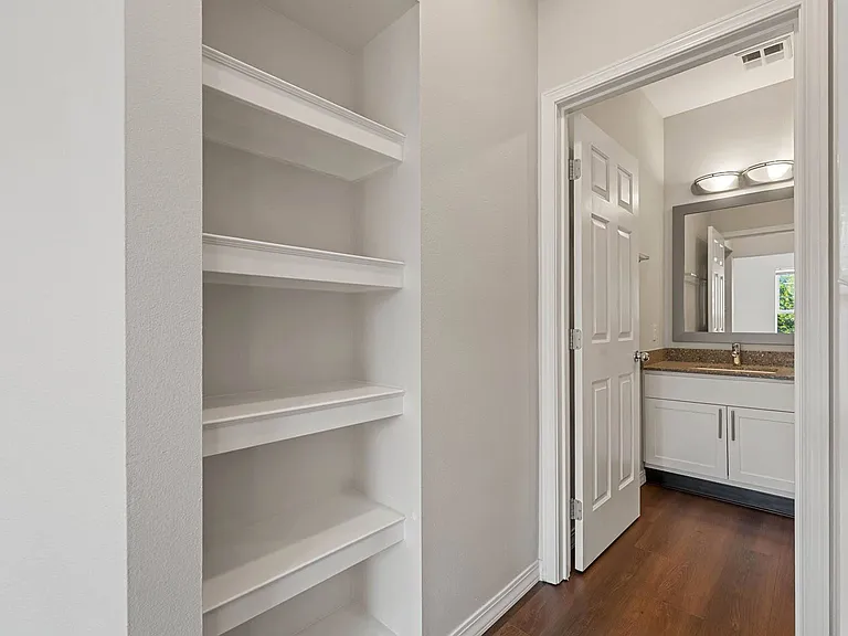 Built-in shelving adds extra storage and everyday convenience