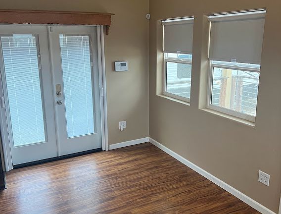 LIVING ROOM WITH SIDE DECK ACCESS