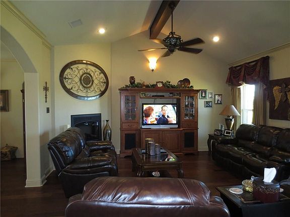 Living room is 23 X 16 with two decorative fans.