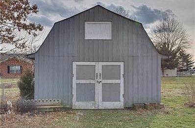 Extra storage needed?  Cement floor and loft space with stairs!