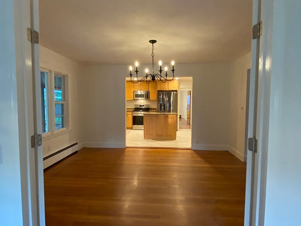 From Sun Room look into Dining Room into Kitchen