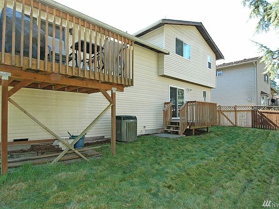 This trilevel offers a lower deck off the family room to the back yard.  The upper deck is off the dining room! Nice and private!