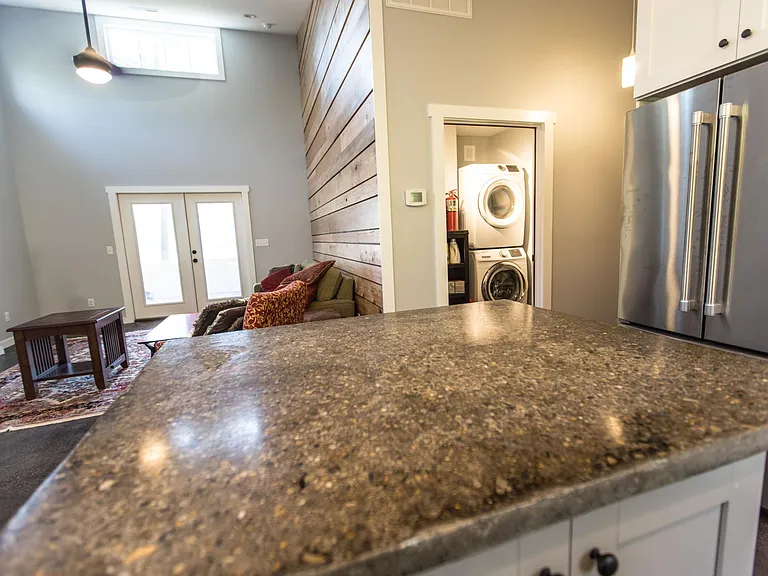Kitchen island, laundry room in background