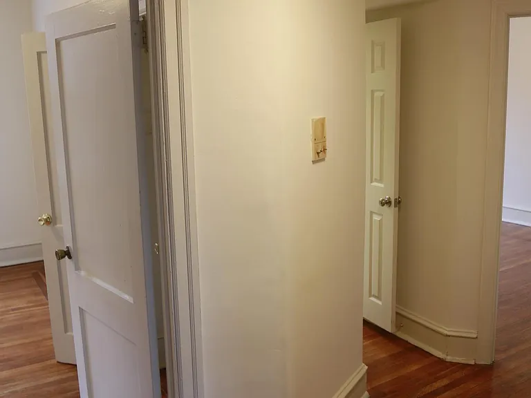 hall way into bedroom, and bathroom area