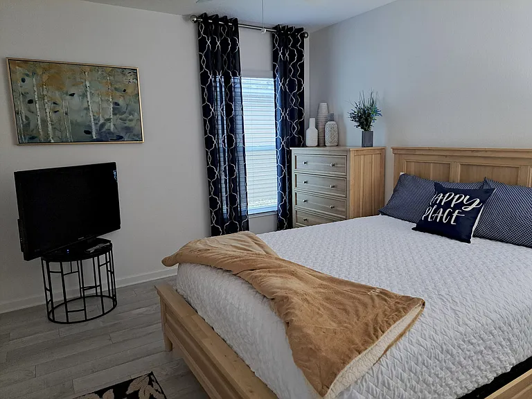 Guest bedroom with TV.