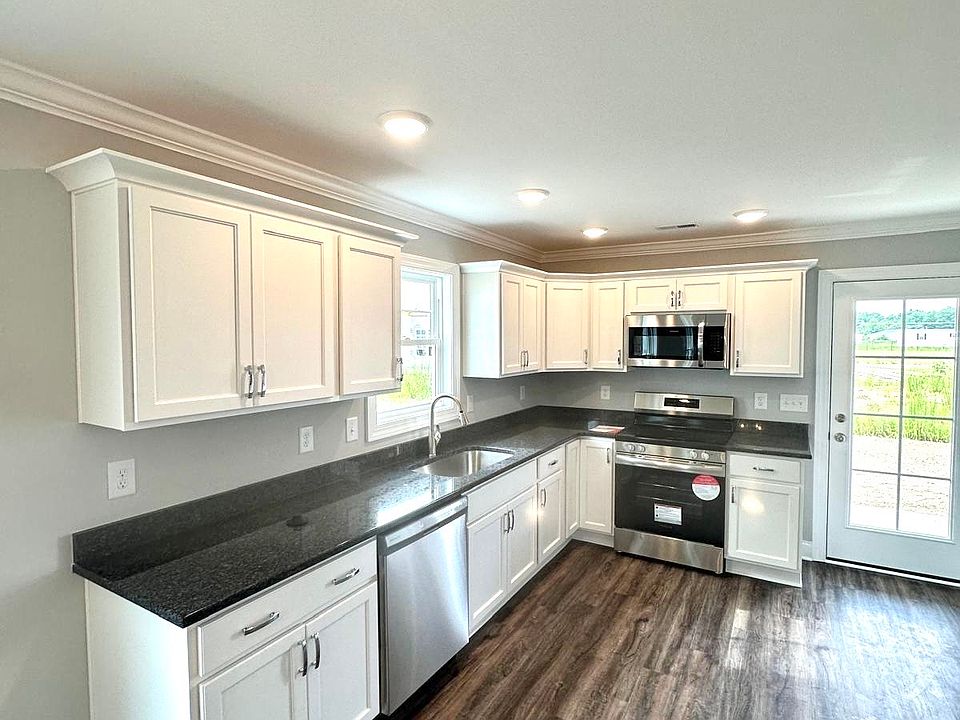Open concept kitchen with lots of storage, and brand new stainless steel appliances.
