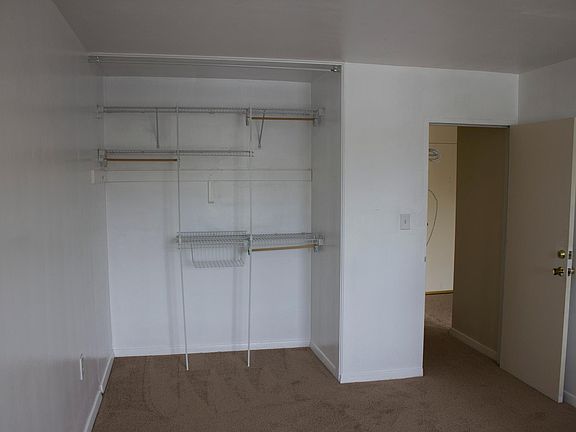 Bedroom closet, opposite window.