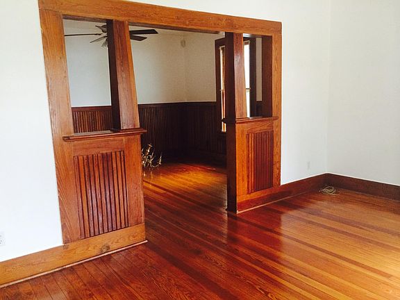 From front door view. Living space first with four windows. Enter to dining/ office space/ before kitchen entrance.