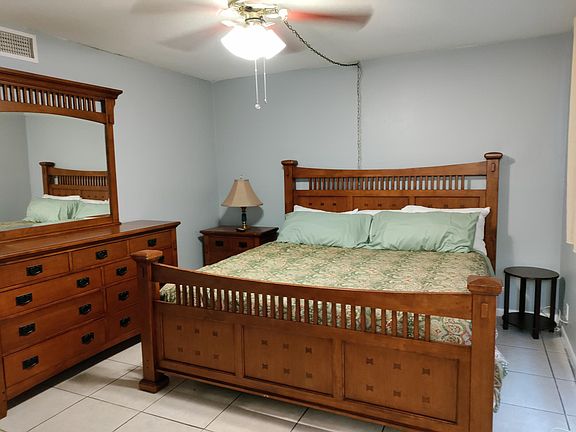 King size bed w/ pillow top mattress 
Walk in closet