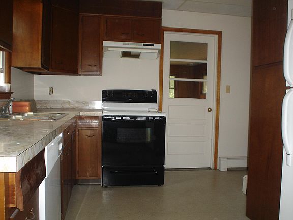Kitchen with Stove, dishwasher, refrigerator and stackable w
