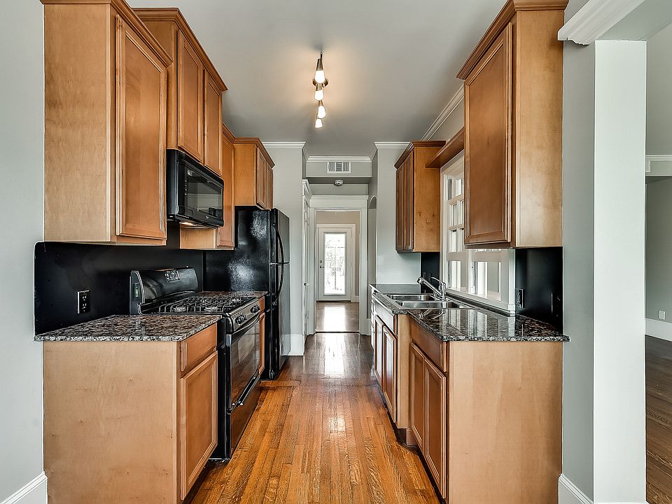 A well-designed galley kitchen with all the amenities! *Please note: image is representative and may not reflect the actual unit or condition of the unit listed.