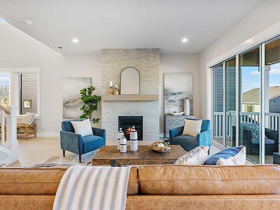 Stacking glass doors from the great room open to the covered patio