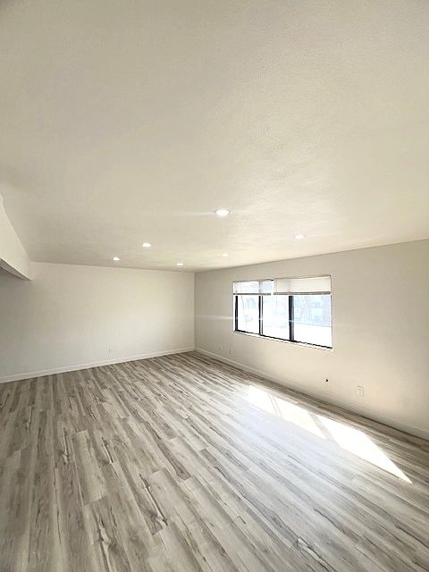 Oversized living room with beautiful luxurious vinyl plank flooring!! Lots of natural lighting...