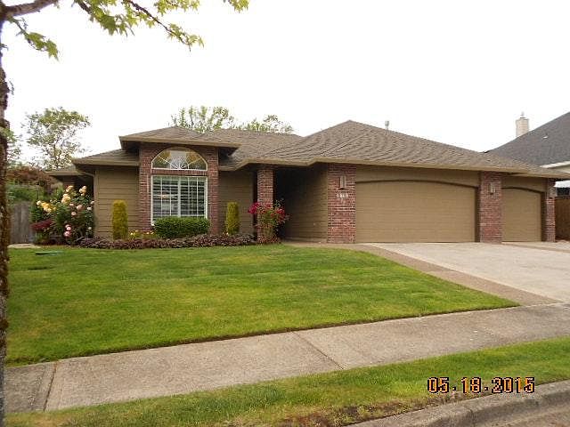 Front, Brick Trim & 3 Car Garage